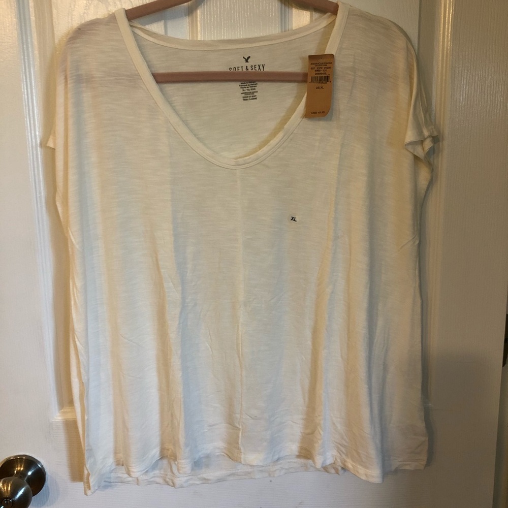 Cream swing tee